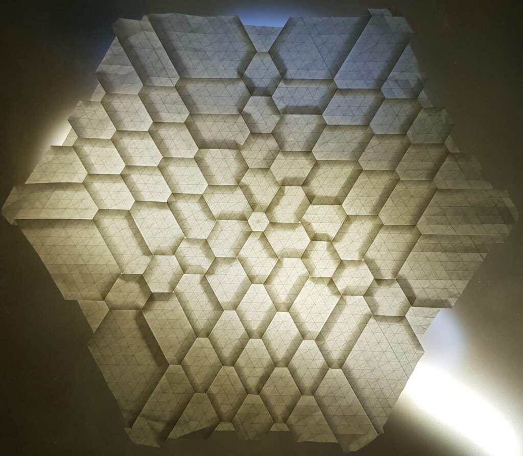 Explosion Model was made from one piece of <br>paper from hexagonic base with<br> tesselation technique.