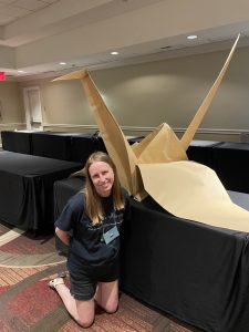 Lisa posing with the beautiful and massive peace crane